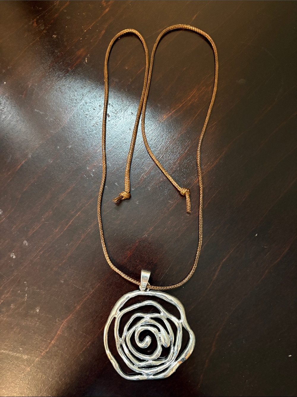 Palm Isle Silver Floral Spiral Pendant Necklace in Brown Cord